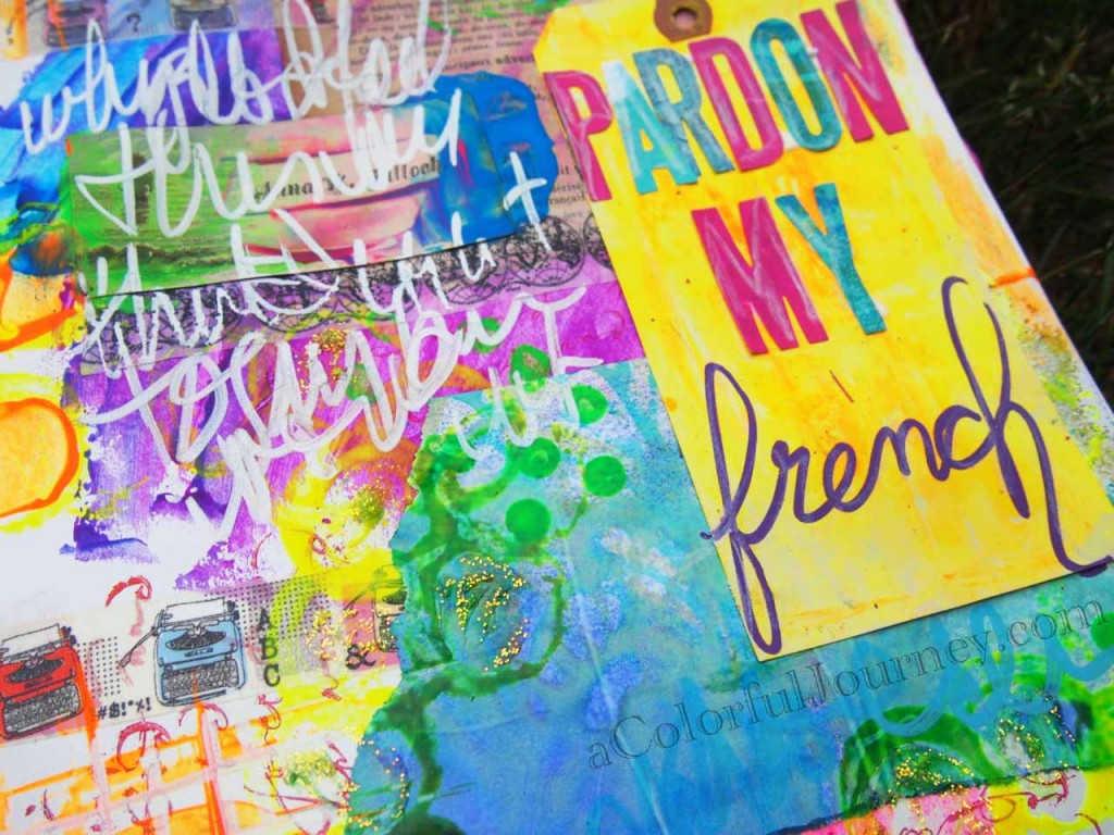 Video of a colorful art journal page with Carolyn Dube