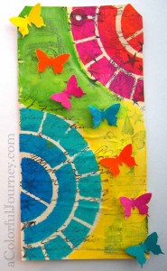 Step by step tag using Pam Carriker's color wheel stencil, rubber stamps, and a butterfly punch by Carolyn Dube 