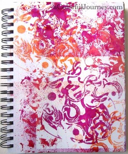 Carolyn Dube art journal page using Dylusions spray inks and a stencil 