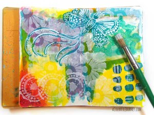 Check out the step by step layers of stenciling building up on this art journal page!