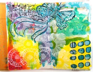 Check out the step by step layers of stenciling building up on this art journal page with a pico embellisher!