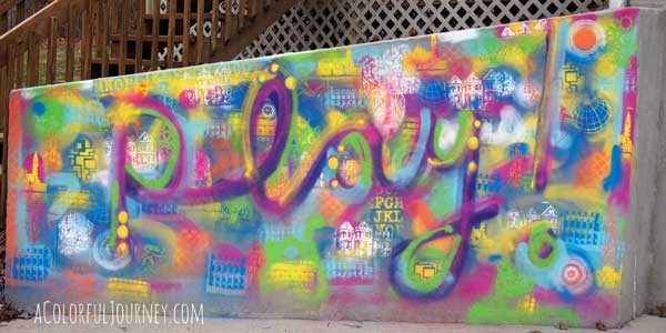 Using chalk spray paints to go crazy with graffiti outside...and it will all wash away by Carolyn Dube