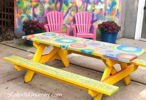 I just couldn't help but paint my picnic table with paint and stencils