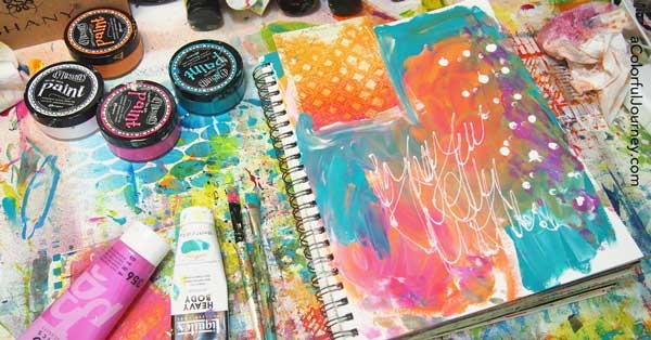 She started this art journal page with a big random mess and the shares it layer by layer!