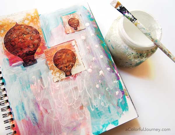 She started this art journal page with a big random mess and the shares it layer by layer!