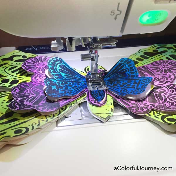 Video creating a fun layered butterfly book for journaling from a stencil