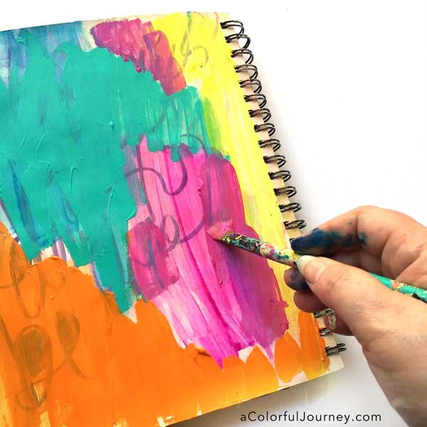 How to take an ugly art journal page and make it better with glitter and a stencil