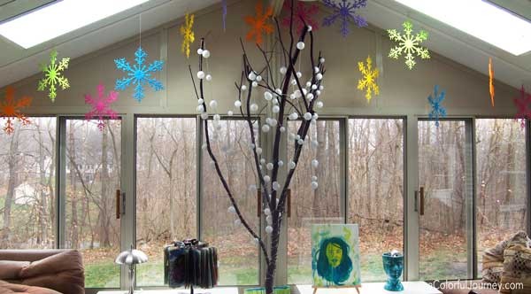 Liquitex spray paint and plastic snowflakes for a bright and rainbow decoration!