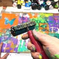 Video showing how the layers built up with gelli printing® and mask on a paper bag for the Let's Play link party