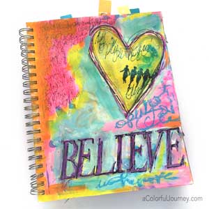 Video sharing how Carolyn took an old art journal page and made it sparkle!
