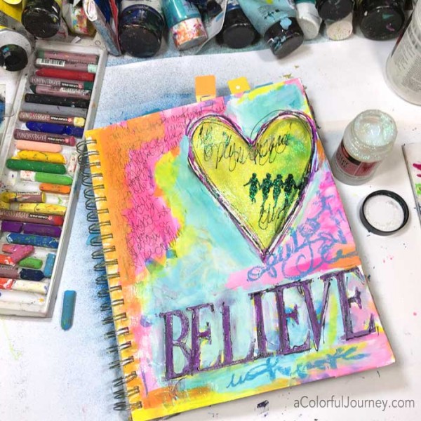 Video sharing how Carolyn took an old art journal page and made it sparkle!