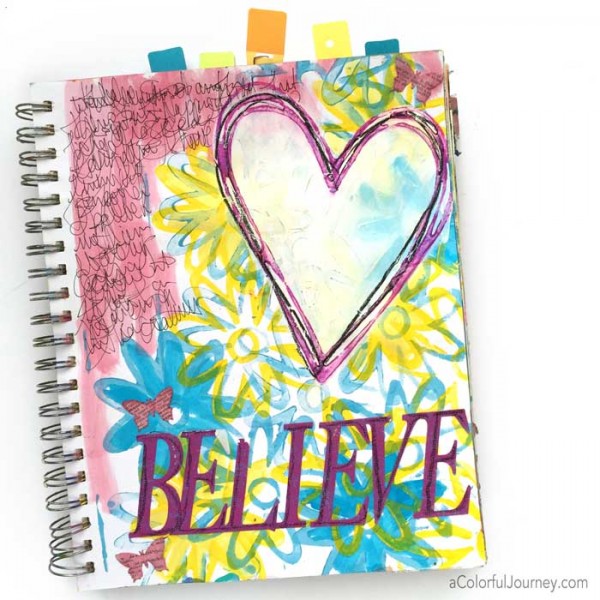 Video sharing how Carolyn took an old art journal page and made it sparkle!