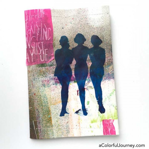 Stenciling the cover of an art journal with silhouettes by Carolyn Dube