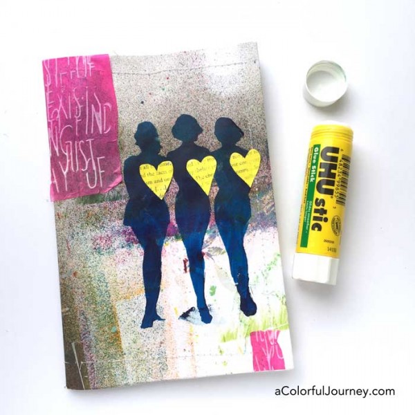 Stenciling the cover of an art journal with silhouettes by Carolyn Dube