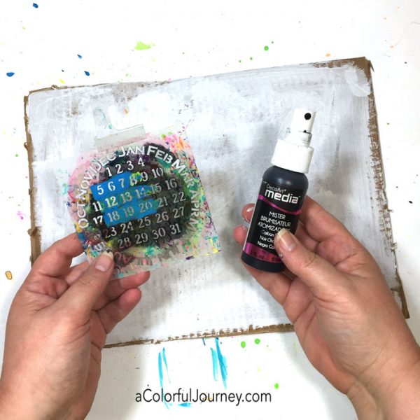 Playing around with a stencil and spray ink on cardboard video tutorial by Carolyn Dube