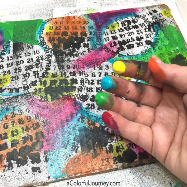 Playing around with a stencil and spray ink on cardboard video tutorial by Carolyn Dube