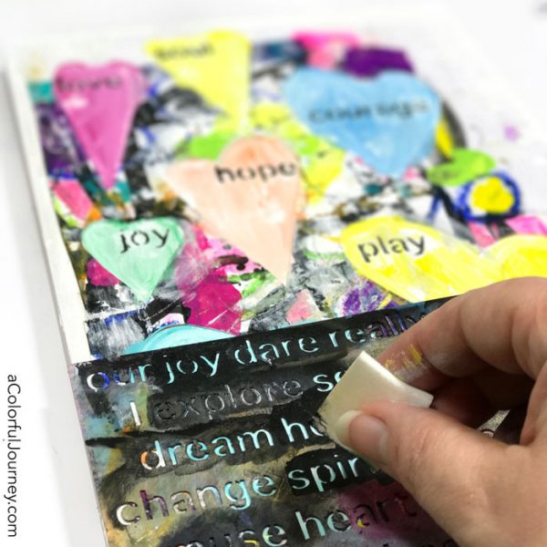 Leftover scraps become stenciled and watercolored mixed media wall art tutorial by Carolyn Dube