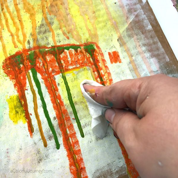 Imaginary creatures appear from paint drips during mixed media play by Carolyn Dube