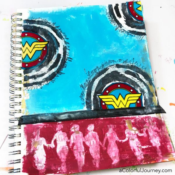 Playing in an art journal with Wonder Woman scraps and stencils and baby wipes by Carolyn Dube