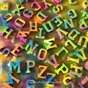 Rescued from decision paralysis by the rainbow while painting letters with liquitex spray paints video by Carolyn Dube